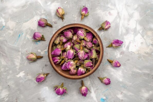 top view purple flowers inside round bowl lined light desk flower plant color photo 140725 22924 1